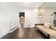 Upstairs hallway with seating area, accent wall, and glass railing at 9743 Covent Garden Dr, Orlando, FL 32827