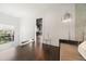 Upstairs hallway with a lounge area featuring a modern accent wall and glass railing at 9743 Covent Garden Dr, Orlando, FL 32827