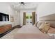 Well-lit bedroom with access to the backyard and an ensuite bathroom at 9743 Covent Garden Dr, Orlando, FL 32827
