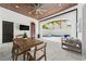 Outdoor area featuring a wood-paneled ceiling, a dining table, TV, and access to a pool area at 9743 Covent Garden Dr, Orlando, FL 32827
