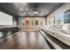 Home theater room with tiered seating, projector screen, and custom cabinetry at 9743 Covent Garden Dr, Orlando, FL 32827