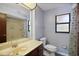 Traditional bathroom with tile shower, toilet, and vanity with a large mirror at 102 Ichabod Trl, Longwood, FL 32750