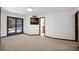 Bedroom featuring double doors leading to patio and view into bathroom at 102 Ichabod Trl, Longwood, FL 32750
