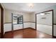 Dining room with hardwood floors, large windows and access to other rooms at 102 Ichabod Trl, Longwood, FL 32750
