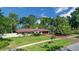 Beautiful single story home with a well manicured lawn and mature landscaping at 102 Ichabod Trl, Longwood, FL 32750