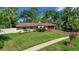 Beautiful single story home with a well manicured lawn and mature landscaping at 102 Ichabod Trl, Longwood, FL 32750