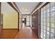 Spacious foyer featuring tile floors and glass block windows for natural light at 102 Ichabod Trl, Longwood, FL 32750