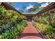 Inviting front entrance with lush landscaping and a charming double-door entryway at 102 Ichabod Trl, Longwood, FL 32750