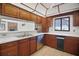 Traditional kitchen featuring wood cabinets, white countertops, and stainless steel appliances at 102 Ichabod Trl, Longwood, FL 32750