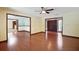 Large living room featuring hardwood floors and multiple entrances at 102 Ichabod Trl, Longwood, FL 32750