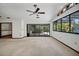Large living room featuring a ceiling fan, brick fireplace, and access to the pool area at 102 Ichabod Trl, Longwood, FL 32750