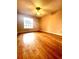Bedroom featuring hardwood floors, a ceiling fan, and a window that provides plenty of natural light at 1057 S Hiawassee Rd # 1913, Orlando, FL 32835