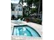Inviting hot tub area with lounge chairs for relaxation at 1057 S Hiawassee Rd # 1913, Orlando, FL 32835