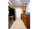 The kitchen features stainless steel appliances and wooden cabinets at 1057 S Hiawassee Rd # 1913, Orlando, FL 32835
