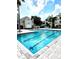Community swimming pool with lane markers and building exterior in background at 1057 S Hiawassee Rd # 1913, Orlando, FL 32835
