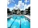 Large community pool with lounge chairs and well-maintained landscaping at 1057 S Hiawassee Rd # 1913, Orlando, FL 32835