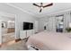 This is a lovely bedroom with a TV, ensuite bath, and lots of closet space at 13108 Lakeshore Grove Dr, Winter Garden, FL 34787