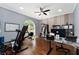 This bright and airy bonus room is great for exercising and working from home at 13108 Lakeshore Grove Dr, Winter Garden, FL 34787
