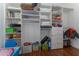 Organized walk-in closet with built-in shelves, drawers, and ample storage space at 13108 Lakeshore Grove Dr, Winter Garden, FL 34787