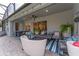 Relaxing screened-in patio features outdoor seating, a table and a manicured landscape at 13108 Lakeshore Grove Dr, Winter Garden, FL 34787