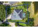 Aerial view of property line featuring large lot, screen enclosed pool, solar panels, and water view at 13108 Lakeshore Grove Dr, Winter Garden, FL 34787