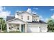 Charming two-story home featuring a two-car garage, stone accents and a bright teal front door at 1454 Pinecliff Dr, Apopka, FL 32703