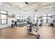 Well-equipped gym featuring treadmills, stationary bikes, and weight training equipment with ample natural light at 1454 Pinecliff Dr, Apopka, FL 32703