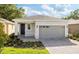 Charming single-Gathering home featuring a gray garage door and landscaped front yard at 150 Fredericksburg Ave, Orange City, FL 32763