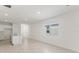 Open concept living area with tile flooring, a window, and a kitchen island at 150 Fredericksburg Ave, Orange City, FL 32763