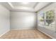 Bright and airy room featuring tile flooring, neutral walls, and a large window, ideal for customization at 15058 Sawgrass Bluff Dr, Winter Garden, FL 34787