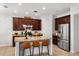 Well-equipped kitchen featuring granite countertops, stainless steel appliances, and a center island at 15058 Sawgrass Bluff Dr, Winter Garden, FL 34787