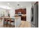 Modern kitchen with stainless steel appliances, granite countertops, and an island with seating at 15058 Sawgrass Bluff Dr, Winter Garden, FL 34787
