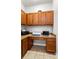 A functional workspace nook equipped with built-in desk and plenty of cabinet storage at 15058 Sawgrass Bluff Dr, Winter Garden, FL 34787