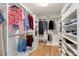 Spacious walk-in closet with custom shelving for optimal organization and storage at 15058 Sawgrass Bluff Dr, Winter Garden, FL 34787