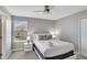 Bedroom showcasing natural light, a queen bed, and contemporary bedside tables at 1533 Flange Dr, Davenport, FL 33896
