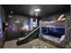Themed bedroom with custom bunk beds and slide, and unique space-themed decor for an immersive experience at 1533 Flange Dr, Davenport, FL 33896