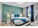 Comfortable bedroom features modern lighting, a queen bed, and blue accents at 1533 Flange Dr, Davenport, FL 33896