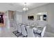 Elegant dining room with a large table, chandelier, and plenty of seating for entertaining at 1533 Flange Dr, Davenport, FL 33896