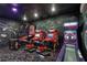 Amusement room featuring arcade games, custom murals, and unique lighting and carpet at 1533 Flange Dr, Davenport, FL 33896