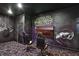 Game room boasts custom Star Wars wall murals, theater chairs, and unique carpet at 1533 Flange Dr, Davenport, FL 33896