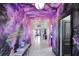 Hallway with unique Star Wars themed decor and leading into an open floor plan at 1533 Flange Dr, Davenport, FL 33896