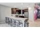 Modern kitchen with stainless steel appliances, granite countertops, and a spacious island at 1533 Flange Dr, Davenport, FL 33896