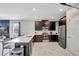 Modern kitchen with stainless steel appliances, granite countertops, and a spacious island at 1533 Flange Dr, Davenport, FL 33896