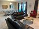 Spacious living area offering comfortable seating, modern décor, and an open concept design for seamless entertaining at 1533 Flange Dr, Davenport, FL 33896