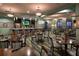 Community restaurant space with tables, chairs and a full bar at 1533 Flange Dr, Davenport, FL 33896