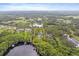 Aerial view showcases an expansive property with stunning lake views at 1550 Bluewater Run, Chuluota, FL 32766