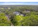 Sprawling property featuring lush landscaping, a pool, and additional structures, captured from an aerial perspective at 1550 Bluewater Run, Chuluota, FL 32766