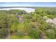 Expansive aerial view of the estate showcasing lush landscaping, lake access, and private grounds at 1550 Bluewater Run, Chuluota, FL 32766