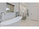Modern bathroom featuring a standalone tub and a separate walk-in shower at 1550 Bluewater Run, Chuluota, FL 32766