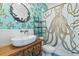 Whimsical bathroom with unique octopus shower curtain and decorative wall accents at 1550 Bluewater Run, Chuluota, FL 32766
